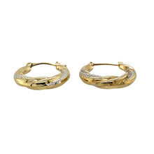 Load image into Gallery viewer, Add a touch of elegance to your jewellery collection with these pre-owned 9ct yellow and white gold patterned hoop creole earrings, featuring:

Design: Stylish hoop creole earrings with an intricate patterned finish for added texture and sophistication.
Material: 9-carat yellow and white gold, creating a beautiful two-tone contrast.
Weight: A lightweight 1.40 grams, ensuring comfort for everyday wear.
A versatile and refined accessory, perfect for adding subtle elegance to any outfit.
