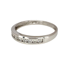 Load image into Gallery viewer, Add a touch of elegance to your jewellery collection with this pre-owned 9ct white gold &amp; diamond set band ring, featuring:

Design: A classic band ring, adorned with sparkling diamonds for a refined and sophisticated look.
Material: 9-carat white gold, offering a sleek and modern appeal.
Gemstones: Set with diamonds, adding brilliance and elegance.
Size &amp; Weight: Designed in size Q, with a lightweight yet durable 1.80 grams for a comfortable fit.
Front Dimensions: Measures 4mm wide, making it a del
