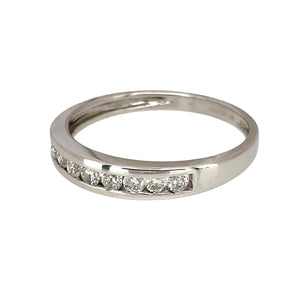 Add a touch of elegance to your jewellery collection with this pre-owned 9ct white gold &amp; diamond set band ring, featuring:

Design: A classic band ring, adorned with sparkling diamonds for a refined and sophisticated look.
Material: 9-carat white gold, offering a sleek and modern appeal.
Gemstones: Set with diamonds, adding brilliance and elegance.
Size & Weight: Designed in size Q, with a lightweight yet durable 1.80 grams for a comfortable fit.
Front Dimensions: Measures 4mm wide, making it a del