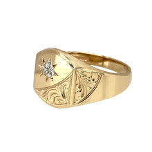 Load image into Gallery viewer, Add a refined and classic touch to your jewellery collection with this pre-owned 9ct yellow gold &amp; diamond illusion set engraved signet ring, featuring:

Design: A traditional signet ring with a diamond illusion setting in white gold, enhancing the stone’s brilliance, and intricate engraving for added detail.
Material: 9-carat yellow gold, with a white gold setting, creating a timeless contrast.
Gemstone: Set with a diamond illusion setting, giving the appearance of a larger, more radiant stone.
Size &amp; Weig
