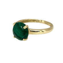 Load image into Gallery viewer, Add a touch of natural beauty to your jewellery collection with this pre-owned 9ct yellow gold &amp; malachite set ring, featuring:

Design: A classic gemstone ring, showcasing a striking malachite stone with its signature green banding.
Material: 9-carat yellow gold, offering a warm and timeless appeal.
Gemstone: Features a 9mm diameter malachite, known for its rich green hues and unique natural patterns.
Size &amp; Weight: Designed in size K, with a lightweight yet durable 1.60 grams for a comfortable fit.

