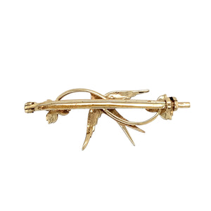 Add a touch of vintage charm to your jewellery collection with this pre-owned 9ct yellow gold seed pearl & green stone vintage swallow brooch, featuring:

Design: A beautifully detailed swallow brooch, symbolising love, freedom, and safe return.
Material: 9-carat yellow gold, offering a warm and timeless appeal.
Gemstones: Adorned with delicate seed pearls and a vibrant green stone, enhancing its vintage elegance.
Weight: A solid 4 grams, ensuring durability while maintaining a refined and classic look.