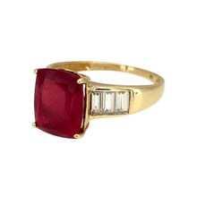 Load image into Gallery viewer, Add a bold and elegant touch to your jewellery collection with this pre-owned 9ct yellow gold red stone &amp; cubic zirconia set ring, featuring:

Design: A timeless and sophisticated setting, showcasing a striking red stone complemented by sparkling cubic zirconia accents.
Material: Crafted in 9-carat yellow gold, offering a classic and refined appeal.
Gemstones: Features a captivating 10mm x 8mm red stone, enhanced by shimmering cubic zirconia for added brilliance.

