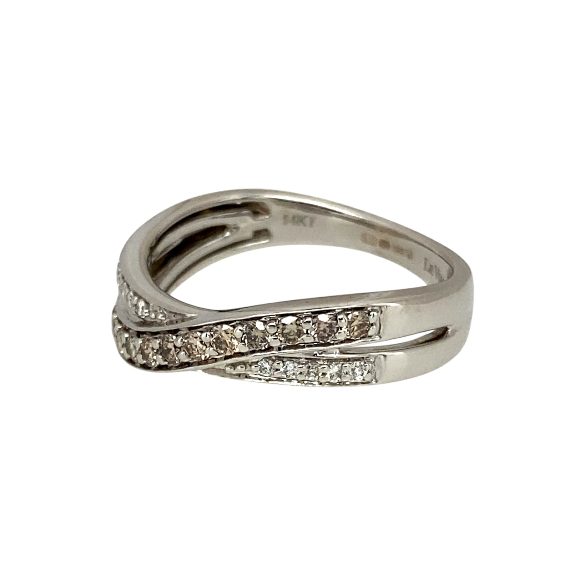 Add a unique and elegant touch to your jewellery collection with this pre-owned 14ct white gold & diamond set crossover band ring, featuring:

Design: A stylish crossover band, creating a modern and sophisticated look.
Material: Crafted in 14-carat white gold, offering a sleek and polished finish.
Gemstone Arrangement: Features a stunning combination of chocolate and white diamonds, adding depth and contrast.
