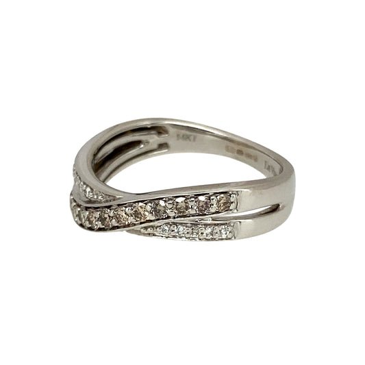 Add a unique and elegant touch to your jewellery collection with this pre-owned 14ct white gold & diamond set crossover band ring, featuring:

Design: A stylish crossover band, creating a modern and sophisticated look.
Material: Crafted in 14-carat white gold, offering a sleek and polished finish.
Gemstone Arrangement: Features a stunning combination of chocolate and white diamonds, adding depth and contrast.
