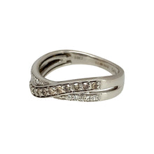 Load image into Gallery viewer, Add a unique and elegant touch to your jewellery collection with this pre-owned 14ct white gold &amp; diamond set crossover band ring, featuring:

Design: A stylish crossover band, creating a modern and sophisticated look.
Material: Crafted in 14-carat white gold, offering a sleek and polished finish.
Gemstone Arrangement: Features a stunning combination of chocolate and white diamonds, adding depth and contrast.

