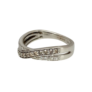 Add a unique and elegant touch to your jewellery collection with this pre-owned 14ct white gold & diamond set crossover band ring, featuring:

Design: A stylish crossover band, creating a modern and sophisticated look.
Material: Crafted in 14-carat white gold, offering a sleek and polished finish.
Gemstone Arrangement: Features a stunning combination of chocolate and white diamonds, adding depth and contrast.

