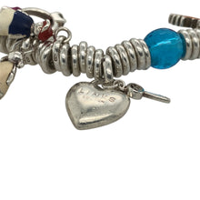 Load image into Gallery viewer, Add a fun and stylish piece to your jewellery collection with this pre-owned 925 silver Links of London Sweetie charm bracelet, featuring:

Design: The iconic Sweetie charm bracelet, known for its flexible, stacked ring design and customisable charm collection.
Material: 925 sterling silver, ensuring a high-quality and polished finish.
Charms Included: Features an array of unique charms, including an acorn, flower, two people, solitaire ring, star, seahorse, and more
