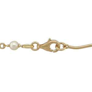 Add a touch of timeless elegance to your jewellery collection with this pre-owned 9ct yellow gold and pearl set necklace.

Design: A delicate 16" chain adorned with 13 evenly spaced pearls, creating a refined and graceful look.
Material: Made from 9-carat yellow gold, offering a warm and polished finish that beautifully complements the pearls.
Gemstone Detail: Each pearl measures 5mm in diameter, adding a classic and sophisticated touch.
Size & Weight: Weighing 8.60 grams, this necklace