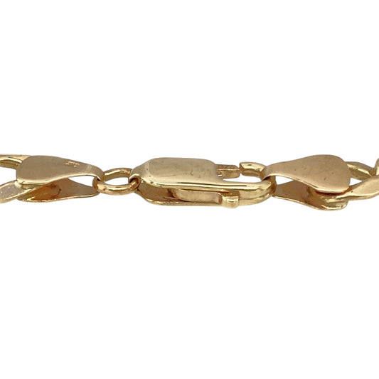 Add a bold and timeless piece to your jewellery collection with this pre-owned 9ct yellow gold 8.5" curb bracelet.

Design: A classic curb link design, offering a sleek and sophisticated look that never goes out of style.
Material: Made from 9-carat yellow gold, providing a warm and polished finish for a luxurious feel.
Size & Weight: The bracelet measures 8.5 inches in length, has a link width of 7mm, and weighs 14.70 grams, ensuring a sturdy and comfortable fit.
