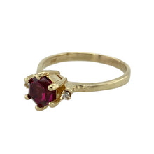 Load image into Gallery viewer, Add a touch of colour and sophistication to your collection with this pre-owned 14ct yellow gold diamond and pink tourmaline set ring, combining bold design with elegant sparkle, featuring:

Design: A striking six-sided dark pink tourmaline takes centre stage, set vertically for a modern and distinctive look, accented by sparkling diamonds for added brilliance.
Material: Made from 14-carat yellow gold, the warm
