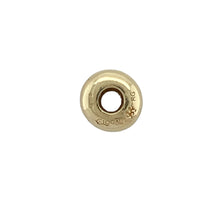 Load image into Gallery viewer, Bring elegant function to your charm bracelet with this pre-owned 9ct yellow gold Clogau bead stopper charm, designed to add both beauty and practicality—perfect for keeping charms in place with refined style.

Design: This simple yet stylish stopper charm helps secure your beads and charms on a bracelet, while its smooth, polished finish adds a touch of classic elegance.
Material: Made from 9-carat yellow gold, the high-shine surface showcases Clogau’s signature quality with a timeless golden glow.

