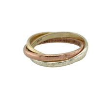 Load image into Gallery viewer, Bring timeless harmony and elegant contrast to your collection with this pre-owned 9ct yellow, white, and rose gold triple band ring, featuring a symbolic rolling design—perfect for meaningful gifting or everyday sophistication.

Design: The ring is made up of three interlinked bands—each 2mm wide in yellow, white, and rose gold—creating a classic rolling ring that symbolises unity, love, and balance.

