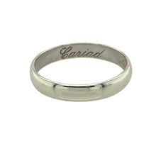 Load image into Gallery viewer, Bring heartfelt sentiment and timeless elegance to your collection with this pre-owned 9ct white gold Clogau Cariad wedding band ring, featuring refined design and a hidden message of love—perfect for meaningful commitments or personal keepsakes.

Design: The 4mm wide band offers a classic polished profile with the word Cariad (Welsh for “beloved”) engraved on the inside, symbolising love and affection.

