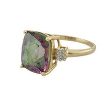 Load image into Gallery viewer, Add iridescent colour and a touch of sparkle to your jewellery collection with this pre-owned 9ct yellow gold mystic topaz and diamond ring—a vibrant and eye-catching design with timeless appeal.

Design: The ring features a 12mm by 10mm rectangular mystic topaz at the centre, showcasing shifting hues of green, purple, and blue. On either side, a small cluster of diamonds adds delicate sparkle and balance to the bold centre stone.

