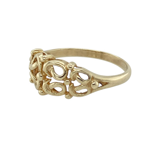 Add delicate charm and vintage-inspired elegance to your collection with this pre-owned 9ct yellow gold open filigree patterned ring—lightweight, detailed, and full of character.

Design: The ring features an intricate open filigree pattern across the front, measuring 8mm high, showcasing graceful curves and fine detailing for a lace-like effect.
Material: Made from 9-carat yellow gold, the polished finish enhances the ornate design and offers a warm, timeless glow.

