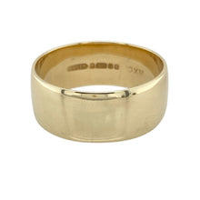 Load image into Gallery viewer, Make a bold and lasting statement with this pre-owned 9ct yellow gold wedding band ring—classic in sentiment with a strong, standout design.

Design: This wide 10mm band features a smooth, polished surface and traditional profile, offering a substantial and confident look.
Material: Made from 9-carat yellow gold, the warm finish enhances its timeless appeal and delivers a rich, elegant glow.

