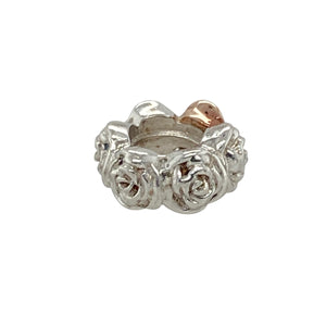Add a touch of natural beauty to your collection with this pre-owned Clogau rose charm—crafted in 925 silver with 9ct rose gold detailing for a timeless and romantic accent.

Design: The charm features a delicate rose motif, symbolising love and elegance, with detailed petals in 9ct rose gold for a warm, graceful finish.
Material: Made from sterling silver and 9-carat rose gold, the polished combination creates a soft contrast that enhances the charm’s floral design.
