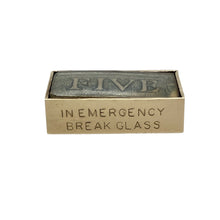 Load image into Gallery viewer, Add a touch of humour and nostalgic charm to your collection with this pre-owned 9ct yellow gold vintage folded £5 note case charm—cleverly designed and full of character.

Design: The charm is styled as a miniature folded case containing a £5 note, with engraved wording at the bottom that reads “In emergency break glass”, giving it a playful and collectible appeal.
Material: Made from 9-carat yellow gold, the polished finish enhances the detailed folds and vintage-inspired design.

