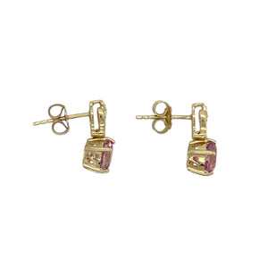 Add a touch of feminine sparkle and graceful colour to your collection with these pre-owned 9ct yellow gold diamond and pink stone set drop earrings—elegant, radiant, and perfect for special occasions or everyday charm.

Design: Each earring features a 6mm round pink stone suspended below a delicate diamond accent, creating a soft, eye-catching drop design with classic appeal.
Material: Made from 9-carat yellow gold, the polished finish beautifully complements the soft pink hue of the stones