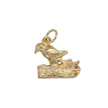 Load image into Gallery viewer, Celebrate nature-inspired detail with this pre-owned 9ct yellow gold bird on tree log charm—full of character and charm, perfect for adding a whimsical touch to any bracelet or pendant chain.

Design: This intricate charm features a detailed bird perched on a textured tree log, capturing a serene moment in miniature form.
Material: Made from 9-carat yellow gold, the polished and textured finishes highlight the fine craftsmanship and warm tone.

