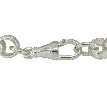 Bring refined detail and bold vintage style to your jewellery collection with this new 925 silver 8.5" patterned engraved gypsy link bracelet—a substantial piece with classic elegance and intricate craftsmanship.

Design: Featuring 5mm wide gypsy links, the bracelet alternates between polished plain links and engraved patterned links, creating a timeless and eye-catching contrast.
