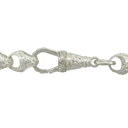 Bring distinctive texture and classic design to your jewellery collection with this new 925 silver 25" patterned acorn link chain—a bold and elegant piece inspired by natural form and traditional style.

Design: Featuring 11mm wide acorn-style links with detailed patterning, this chain showcases a unique shape with rich texture and flowing structure.
Material: Made from solid 925 sterling silver, the polished and engraved finishes enhance the depth and craftsmanship of each individual link.
