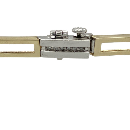 Add contrast, sparkle, and classic elegance to your wrist with this pre-owned 9ct yellow and white gold diamond set bracelet—a refined design with timeless appeal and luxurious detail.

Design: The 7.25" bracelet features alternating 5mm wide open yellow gold bars and diamond-set white gold bars, creating a striking pattern of shimmer and shine.
Material: Made from 9-carat yellow and white gold, the polished finish enhances the warm and cool tones while highlighting the brilliance of the diamonds.
