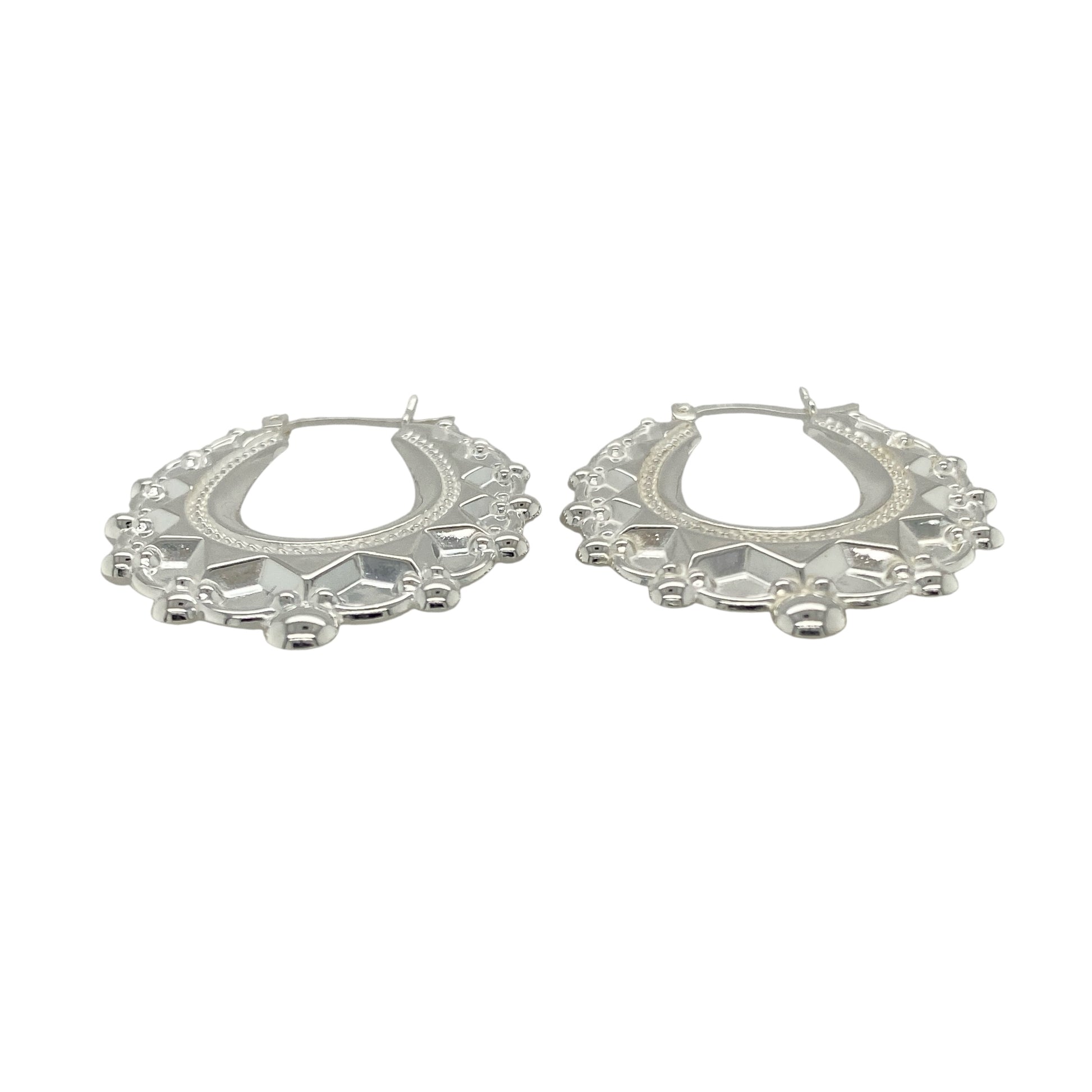 Bring graceful elegance and bold style to your collection with these new 925 silver large fancy oval creole earrings, offering a striking design and refined shine—perfect for making a sophisticated statement.

Design: The earrings feature a large oval creole style with a fancy, detailed finish, measuring approximately 31mm across. Their elongated shape and intricate design create a flattering, eye-catching silhouette that enhances any look.
