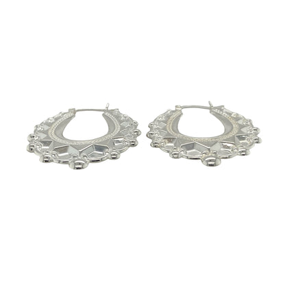 Bring graceful elegance and bold style to your collection with these new 925 silver large fancy oval creole earrings, offering a striking design and refined shine—perfect for making a sophisticated statement.

Design: The earrings feature a large oval creole style with a fancy, detailed finish, measuring approximately 31mm across. Their elongated shape and intricate design create a flattering, eye-catching silhouette that enhances any look.
