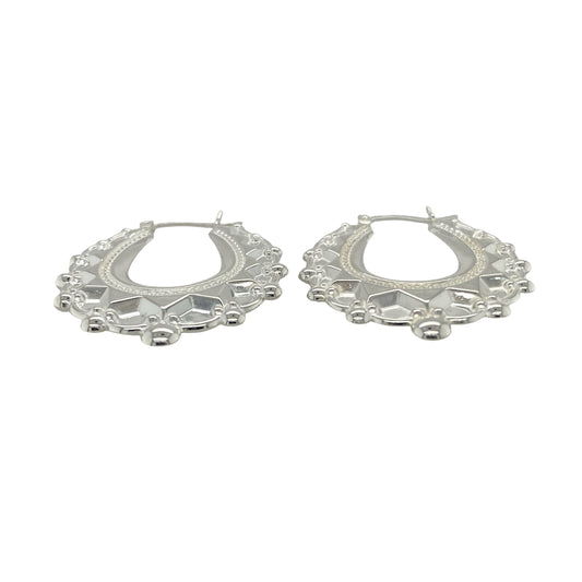 Bring graceful elegance and bold style to your collection with these new 925 silver large fancy oval creole earrings, offering a striking design and refined shine—perfect for making a sophisticated statement.

Design: The earrings feature a large oval creole style with a fancy, detailed finish, measuring approximately 31mm across. Their elongated shape and intricate design create a flattering, eye-catching silhouette that enhances any look.
