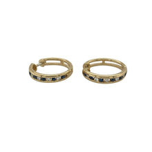 Load image into Gallery viewer, Bring luxurious sparkle and timeless colour to your collection with these pre-owned 18ct yellow gold diamond and sapphire set hoops, offering a refined blend of classic elegance and vibrant detail—perfect for adding sophistication to any look.

Design: Each hoop is adorned with alternating sapphires and diamonds, creating a stunning contrast of deep blue and brilliant sparkle that catches the light beautifully.
