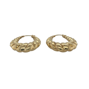Bring elegant texture and timeless shine to your collection with these pre-owned 9ct yellow gold patterned oval creole earrings, offering a sophisticated blend of classic design and eye-catching detail—perfect for elevating any look.

Design: Each earring features an oval creole shape adorned with an intricate patterned finish, creating a refined and striking focal point that stands out beautifully.
