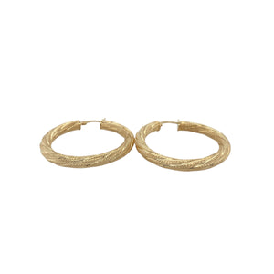 Bring elegant texture and timeless shine to your collection with these pre-owned 9ct yellow gold patterned twist hoop creole earrings, offering a sophisticated design and eye-catching detail — perfect for any occasion.

Design: These beautiful earrings feature a classic hoop creole shape with a graceful twist design, enhanced by subtle patterning that adds depth and refined character.