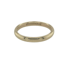 Load image into Gallery viewer, Bring subtle elegance and warm golden tones to your collection with this pre-owned 9ct yellow gold 2mm court wedding band ring—an understated symbol of love and commitment, perfect for everyday wear or marking a meaningful milestone.

Design: The ring features a classic court shape with softly rounded edges, offering a smooth and timeless profile suited to both traditional and modern tastes.


