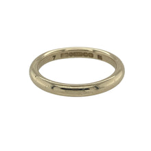 Load image into Gallery viewer, Bring subtle elegance and warm golden tones to your collection with this pre-owned 9ct yellow gold 2.5mm court wedding band ring—an understated symbol of love and commitment, perfect for everyday wear or marking a meaningful milestone.

Design: The ring features a classic court shape with softly rounded edges, offering a smooth and timeless profile suited to both traditional and modern tastes.

