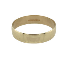 Load image into Gallery viewer, Embrace classic simplicity with this pre-owned 9ct yellow gold wedding band ring—sleek, timeless, and perfect for everyday wear or marking a meaningful commitment.

Design: The ring features a traditional 6mm wide band with a smooth, rounded profile, offering a clean and enduring look.
Material: Made from 9-carat yellow gold, the polished finish delivers a warm, understated shine.
Ring Detail: With its unembellished design, the band is suited for both standalone wear or pairing with other pieces.

