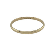 Load image into Gallery viewer, Delicate and timeless, this pre-owned 9ct yellow gold wedding band ring offers subtle elegance—perfect for stacking, everyday wear, or marking a meaningful moment.

Design: The ring features a fine 1.5mm wide band with a smooth, rounded profile, delivering a minimalist and graceful look.
Material: Made from 9-carat yellow gold, the polished finish adds a soft, warm glow to the slender design.

