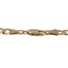 Load image into Gallery viewer, Bold and stylish, this pre-owned 9ct yellow and white gold curb bracelet features eye-catching patterning and a solid feel—perfect for elevating everyday looks or adding contrast to your collection.

Design: The bracelet showcases a classic curb link design with 6mm wide links, alternating between polished yellow gold and patterned white gold for added texture and visual interest.


