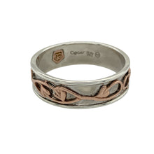 Load image into Gallery viewer, Bring timeless symbolism and bold elegance to your jewellery collection with this pre-owned 925 silver Clogau Tree of Life band ring, featuring 9ct rose gold detailing—perfect for marking life’s meaningful moments with enduring style.

Design: The 7mm wide band features the signature Tree of Life motif, with flowing vines in 9ct rose gold woven into the design to represent growth, strength, and connection.

