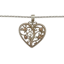 Load image into Gallery viewer, Bring romantic symbolism and graceful detail to your jewellery collection with this pre-owned 925 silver Clogau Tree of Life heart pendant necklace, detailed with 9ct rose gold—perfect for meaningful gifting or everyday elegance.

Design: The pendant measures 2.9cm long including the bail and features an open heart design adorned with flowing 9ct rose gold Tree of Life vines for a warm and intricate finish.

