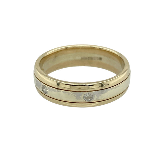 Bring timeless elegance and subtle sparkle to your jewellery collection with this pre-owned 9ct yellow and white gold diamond band ring—perfect for refined everyday wear or special occasions.

Design: The 5mm wide band features a central white gold section set with three diamonds, framed by yellow gold edges for a warm contrast and classic style.
Material: Made from 9-carat yellow and white gold, the polished finish enhances the brilliance of the diamonds and the two-tone design.
