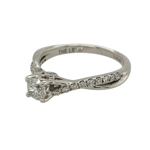 Bring timeless elegance and refined sparkle to your jewellery collection with this pre-owned 18ct white gold solitaire ring, featuring a brilliant-cut diamond centre and diamond-set shoulders—perfect for special occasions or lasting everyday luxury.

Design: The ring showcases a central brilliant-cut diamond, complemented by smaller diamonds along the shoulders, with approximately 0.66ct of total diamond content for a dazzling finish.
