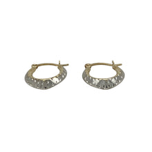 Load image into Gallery viewer, Bring subtle contrast and delicate detail to your jewellery collection with these pre-owned 9ct yellow and white gold patterned pointed oval creole earrings—perfect for everyday elegance.

Design: Each earring features a pointed oval creole shape with fine patterned detailing, combining yellow and white gold for a soft mixed-metal look.
Material: Made from 9-carat yellow and white gold, the polished and textured finishes enhance the design’s refined appearance.

