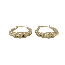 Load image into Gallery viewer, Bring playful texture and classic style to your jewellery collection with these pre-owned 9ct yellow gold bubble style oval creole earrings—perfect for adding subtle charm to everyday wear.

Design: Each earring features an oval creole shape with a raised bubble pattern, creating light-catching texture and a distinctive look.
Material: Made from 9-carat yellow gold, the polished finish enhances the warm golden tone and highlights the unique design.

