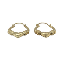 Load image into Gallery viewer, Bring sweet detail and golden warmth to your jewellery collection with these pre-owned 9ct yellow gold heart oval creole earrings—perfect for adding a touch of romance to any look.

Design: Each earring features an oval creole shape with delicate heart-shaped detailing, offering subtle charm and feminine style.
Material: Made from 9-carat yellow gold, the polished finish enhances the warm golden tone and highlights the heart motif.

