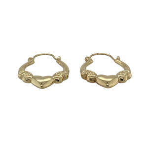 Bring sweet detail and golden warmth to your jewellery collection with these pre-owned 9ct yellow gold heart oval creole earrings—perfect for adding a touch of romance to any look.

Design: Each earring features an oval creole shape with delicate heart-shaped detailing, offering subtle charm and feminine style.
Material: Made from 9-carat yellow gold, the polished finish enhances the warm golden tone and highlights the heart motif.
