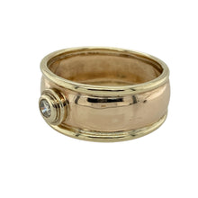 Load image into Gallery viewer, Bring timeless sophistication and understated sparkle to your collection with this pre-owned 9ct yellow gold diamond wide band ring, combining bold design with a touch of elegance—perfect for making a statement on special occasions or adding distinctive charm to your everyday style.

Design: The ring features a smooth, 9mm wide band with a single diamond positioned at the centre, offering a clean, contemporary look with a subtle hint of brilliance.


