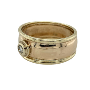 Bring timeless sophistication and understated sparkle to your collection with this pre-owned 9ct yellow gold diamond wide band ring, combining bold design with a touch of elegance—perfect for making a statement on special occasions or adding distinctive charm to your everyday style.

Design: The ring features a smooth, 9mm wide band with a single diamond positioned at the centre, offering a clean, contemporary look with a subtle hint of brilliance.
