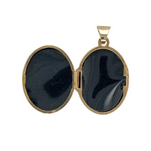 Load image into Gallery viewer, Bring sentimental charm and golden elegance to your collection with this pre-owned 9ct yellow gold oval locket—an enduring keepsake with timeless appeal.

Design: The locket features an oval shape with delicate patterned detailing at the corners, adding a refined decorative touch.
Material: Made from 9-carat yellow gold, the polished finish enhances its warm tone and classic style.

